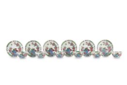 A SET OF SIX CHINESE FAMILLE ROSE TEA BOWLS AND SAUCERS. Qing Dynasty, Yongzheng period. Decorated