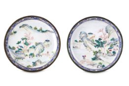 A PAIR OF CHINESE CANTON ENAMEL 'LANDSCAPE' SAUCERS. Qing Dynasty, 18th Century. Each painted with