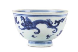 A CHINESE BLUE AND WHITE 'DRAGON' BOWL.  Late Ming Dynasty.   With a gently flared body painted with