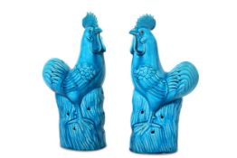 A PAIR OF CHINESE TURQUOISE-GLAZED COCKERELS. Qing Dynasty. Each standing, with the head slightly