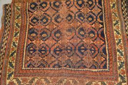 Afshar rug with an all-over repeating design on a blue ground with borders (worn), 181cms x 120cms