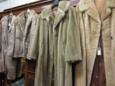 Four various fur and simulated fur ladies jackets and coats, together with a quantity of fur hats