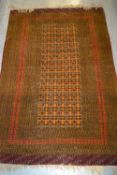 Pakistan rug of Turkoman design on a rust ground, 38ins x 58ins