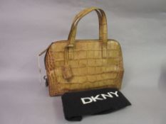 D.K.N.Y. leather simulated crocodile handbag, with dust cover